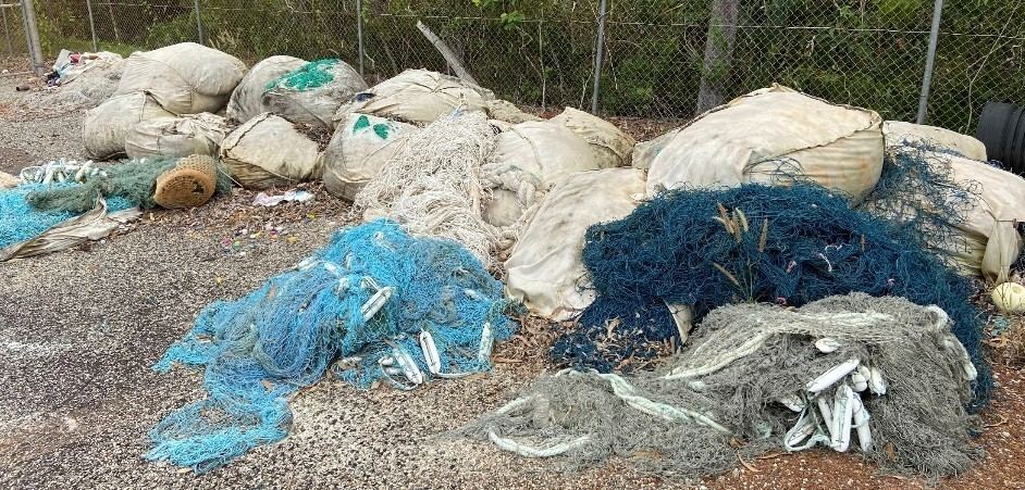 Piles of recovered ghost nets on a beach